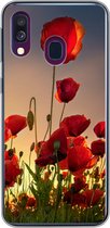 Geschikt voor Samsung Galaxy A40 hoesje - Kleurrijke lucht boven een veld Klaprozen in Denemarken - Siliconen Telefoonhoesje