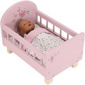 Roze poppenbed met pop, bloemenmotief en houten pootjes.