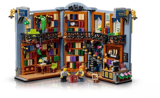 Volledig uitgevouwen LEGO Brickville Books boekenwinkel met twee minifiguren bij de ingang.