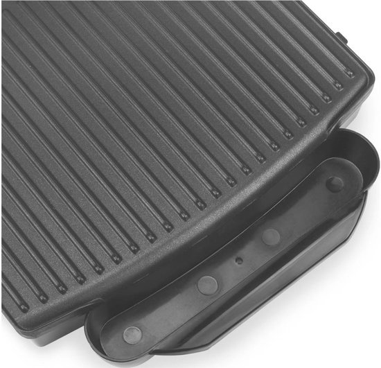 Detail van de geribbelde grillplaat van een zwarte Princess grill met opvangbakje.