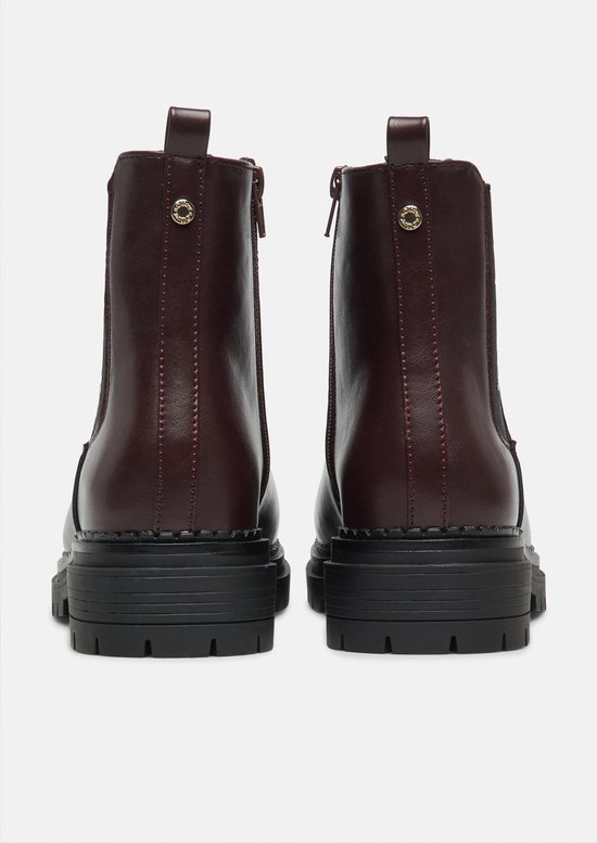 Bottines chelsea en cuir brun foncé avec fermeture éclair et semelle à crampons épaisse, vue arrière.