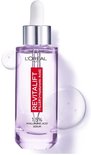 L'Oréal Paris Revitalift Filler serum met 1,5% hyaluronzuur in een helder paarse glazen fles met druppelaar. Druppels serum zweven naast de fles.