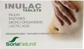 Doosje met Inulac tabletten, met de tekst 'INULAC TABLETS INULIN ENZYMES MICRO-ORGANISMS LACTIC ACID'. Een hand rust op een buik.