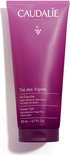 Paarse Caudalie douchegel tube van 200 ml, met tekst. Op een witte achtergrond.