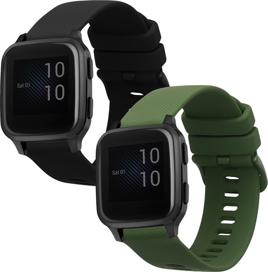 Deux smartwatches, l'une avec un bracelet noir et l'autre avec un bracelet vert foncé, affichant l'heure et la date.