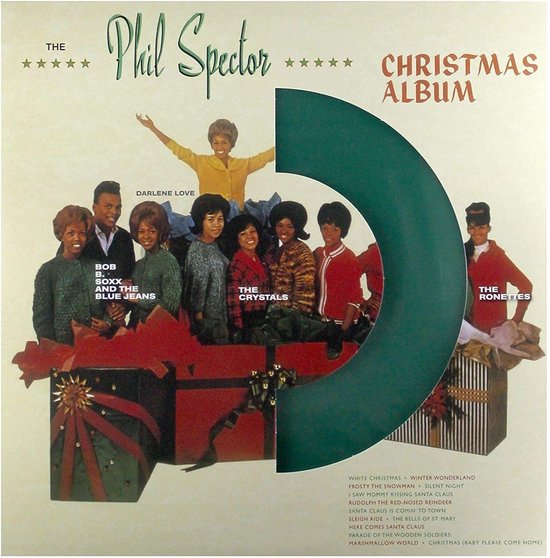 Albumhoes met de tekst 'The Phil Spector Christmas Album'. Groepjes artiesten met cadeaus op de voorgrond.