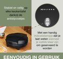 Zwart wafelijzer met antislipvoetjes en indicatielampje, met tekst over gebruiksgemak.