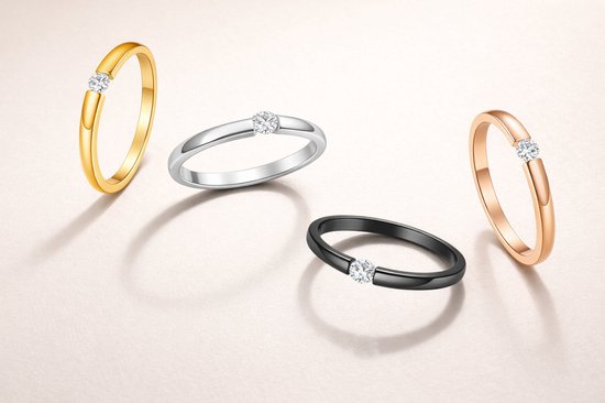 Vier ringen: goud, zilver, zwart en roségoud, elk met een diamant.