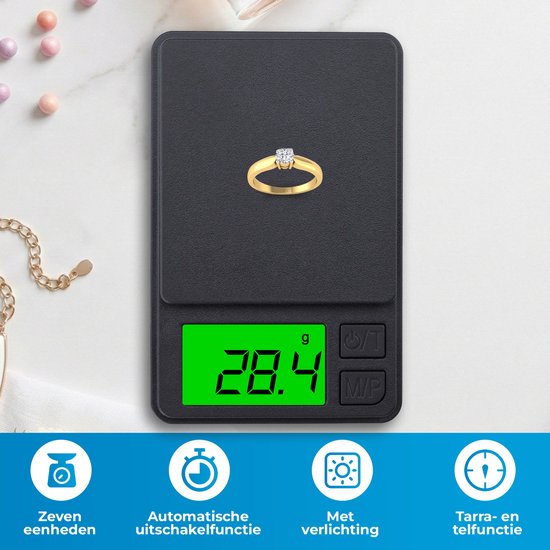 Gouden ring met diamanten op een zwarte digitale weegschaal die 28.4 gram aangeeft.