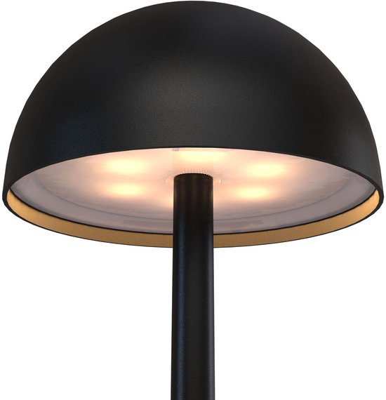 Gros plan du dessous d'un abat-jour de lampe de table rond et noir avec des LED visibles.