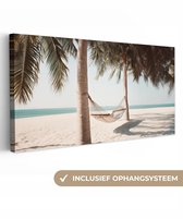 Canvas schilderij 100x50 cm - Wanddecoratie Hangmat - Palmbomen - Strand - Zee - Muurdecoratie woonkamer - Slaapkamer decoratie - Kamer accessoires - Schilderijen op canvas