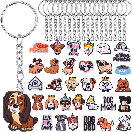 Sleutelring met ketting en een hondjes bedel, samen met een reeks extra bedels met honden- en kattenmotieven.