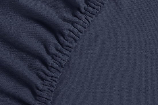 Donkerblauw jersey hoeslaken met elastische zoom.