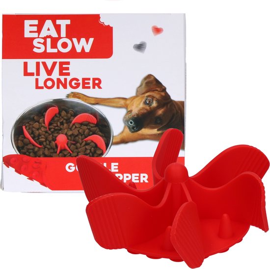Rode 'gobble stopper' voerpuzzel naast de verpakking met de tekst 'Eat Slow Live Longer'.