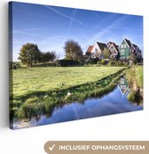 Canvas Schilderij Nederlands landschap met typisch Hollandse huizen - 120x80 cm - Wanddecoratie