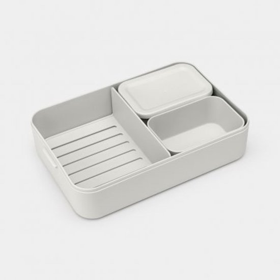 Boîte à pain grise avec deux compartiments internes, dont un avec couvercle.