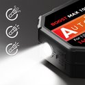 Batterie de démarrage AutoXtreme noire avec lampe de poche allumée et trois icônes SOS.
