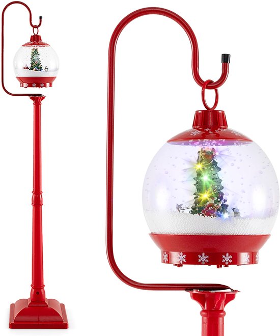 Haute lanterne de Noël rouge avec une grande boule à neige et une petite boule à neige.