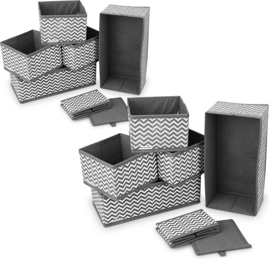 Boîtes de rangement Navaris avec un motif en zigzag gris et blanc, gris uni à l'intérieur. Différentes tailles et modèles pliables.