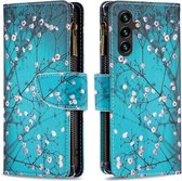 Telefoonhoesje geschikt voor Samsung Galaxy A15 - Portemonnee met rits - book-case hoesje - ruimte voor 9 pasjes - Blauw bloemen