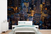 Behang - Fotobehang New York - Manhattan - Nacht - Breedte 600 cm x hoogte 400 cm