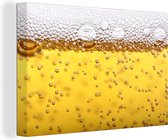 Canvas Schilderij Bierbubbels in glas met bier - 120x80 cm - Wanddecoratie