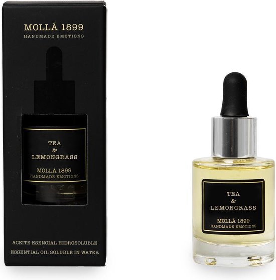 Zwart doosje en een glazen flesje met zwarte druppelaar, beide met 'TEA & LEMONGRASS MOLLÁ 1899 HANDMADE EMOTIONS'.