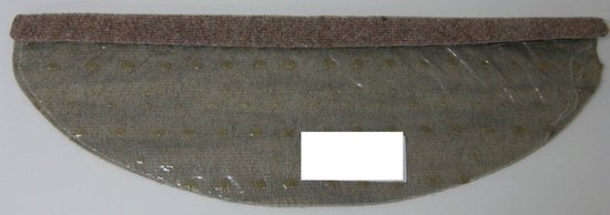 Beige trapmat met textielrand en doorzichtige achterkant met noppen.
