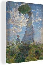 Canvas schilderij 120x160 cm - Wanddecoratie Woman with a Parasol - Schilderij van Claude Monet - Muurdecoratie woonkamer - Slaapkamer decoratie - Kamer accessoires - Schilderijen