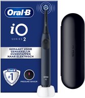 Bol.com Oral-B iO2 Dark Blue Elektrische Tandenborstel + 1 Opzetborstel + 1 Reisetui aanbieding