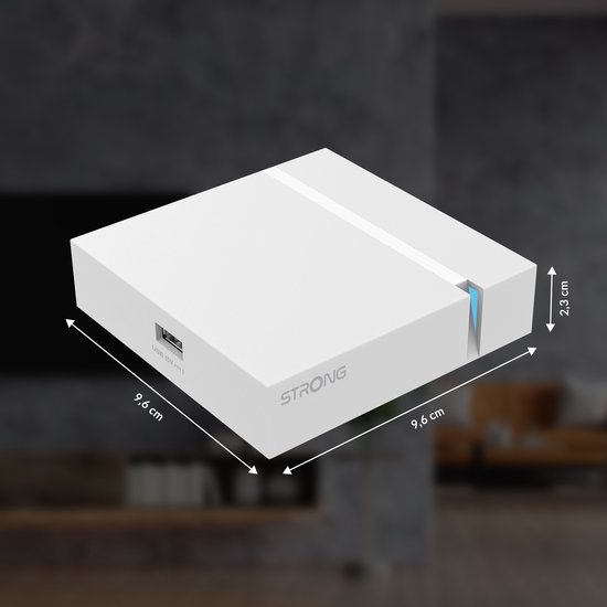 Witte STRONG mediaspeler met afmetingen 9,6 cm x 9,6 cm x 2,3 cm.
