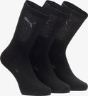 Drie zwarte sokken met ribbels en Puma-logo op de kuit.