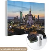 MuchoWow® Glasschilderij 150x100 cm - Schilderij acrylglas - Warschau - Zon - Urban - Foto op glas - Schilderijen