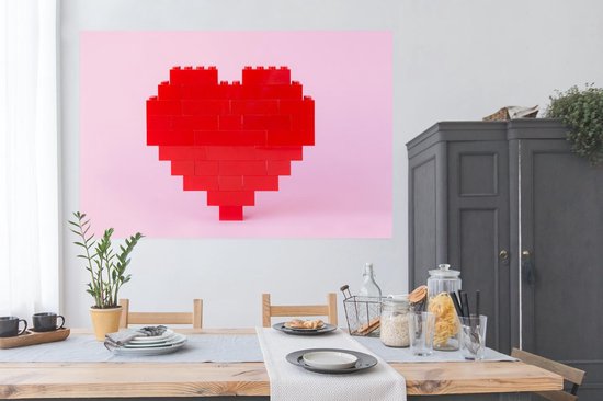 Coeur rouge formé par du papier d'affiche lego