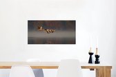 Canvas Schilderij Ganzen - Lucht - Water - 80x40 cm - Wanddecoratie
