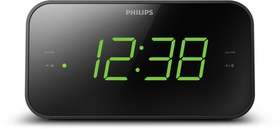 Zwarte Philips wekkerradio met groene digitale cijfers, close-up.