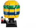 Achterkant van een gele LEGO helm met blauwe en groene strepen, "BELL" logo. Met minifiguur.