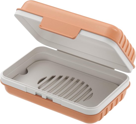 Boîte à savon orange et blanche ouverte, avec intérieur marron et beige.