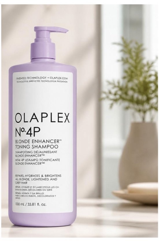 Lila OLAPLEX N°4P fles met pompdispenser en productinformatie.