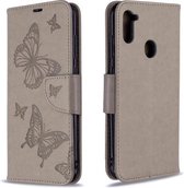 Voor Galaxy A11 Twee vlinders reliëfpatroon horizontaal Flip lederen tas met houder & kaartsleuf & portemonnee & lanyard (grijs)