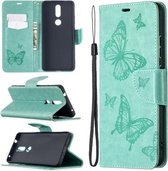 Voor Nokia 2.4 Twee vlinders reliëfpatroon Horizontale flip lederen tas met houder & kaartsleuf & portemonnee & lanyard (groen)