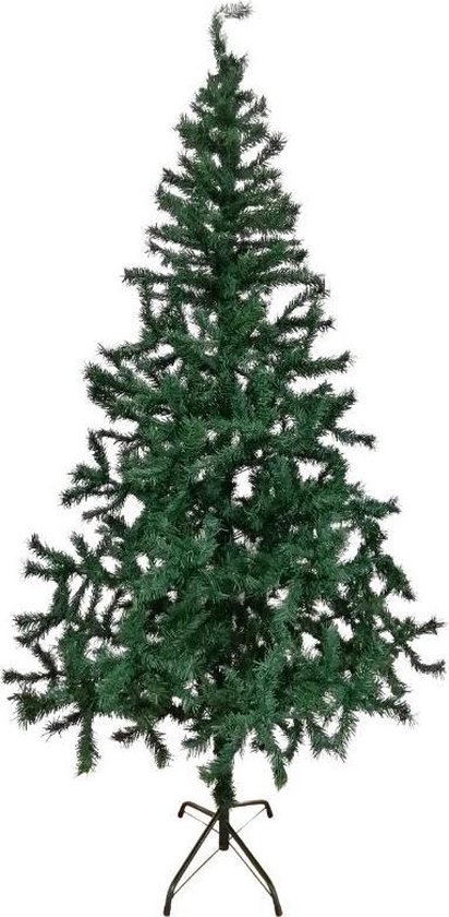 Een Jonge, Sportieve Man In Rode Broek En Kerstmuts Staat Naast Een Snowboard En Houdt Zijn Voet Houden Image128932036