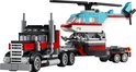 Een rode en zwarte truck met grijs chassis, getrokken door een rode en witte helikopter met blauwe details.