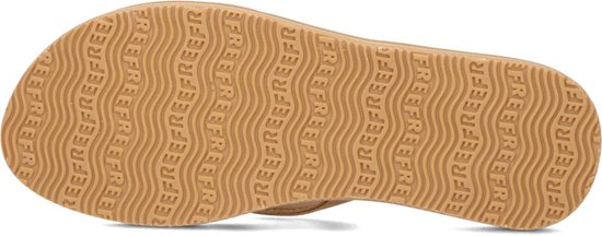 Onderkant van een bruine Reef slipper met golfpatroon en 'REEF'-logo.