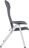 Vue latérale d'une chaise longue gris foncé avec dossier et accoudoirs rembourrés.