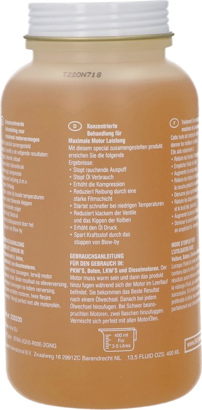 Gouden fles met lichtgele olie. Het etiket bevat productinformatie in meerdere talen.