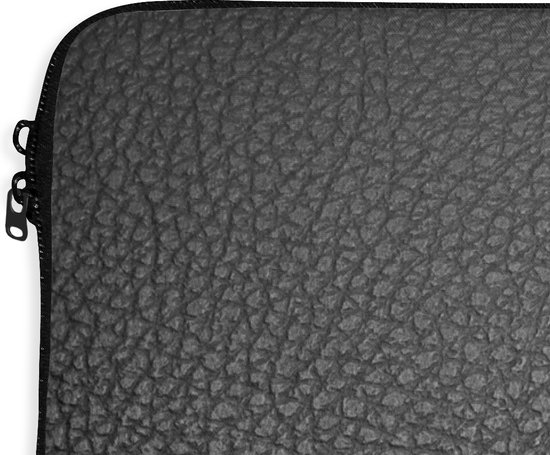 Housse pour ordinateur portable noire avec fermeture éclair, gros plan de la texture.