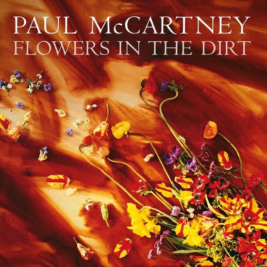 Pochette d'album Paul McCartney Flowers in the Dirt avec des fleurs et un fond rouge-orangé.
