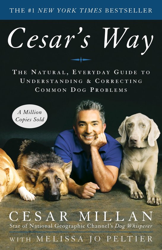 Boek 'Cesar's Way' met Cesar Millan en drie honden.
