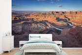 Behang - Fotobehang Knalblauwe lucht boven de Grand Canyon en de Colorado rivier in Utah - Breedte 420 cm x hoogte 280 cm